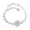 Silver bracelet with round pendants on a white background