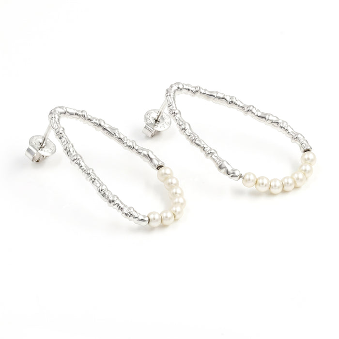 Freshwater pearl open hoop earrings in 18K gold plated and silver plated finish featuring fourteen round pearls and an organic open design