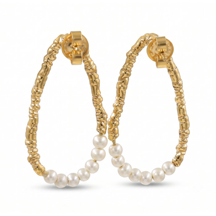 Freshwater pearl open hoop earrings in 18K gold plated and silver plated finish featuring fourteen round pearls and an organic open design