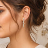 Swarovski crystal geometric statement earrings in 18K gold plated finish with hexagon, square, and round crystal accents.