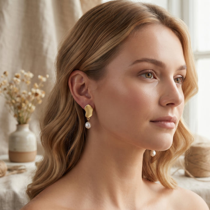 Natural freshwater pearl drop earrings with round 7×7 mm pearls.