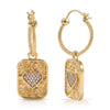 A pair of gold hoop earrings with textured rectangular drop pendants, each featuring a central heart-shaped pavé crystal setting, shown on a clean white background.