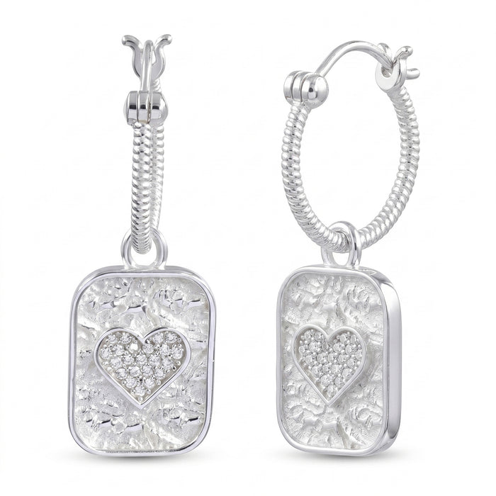 A pair of silver hoop earrings with rectangular dangling charms. Each charm features a textured silver background, a central pavé heart, and a twisted rope detail leading to the hoop.