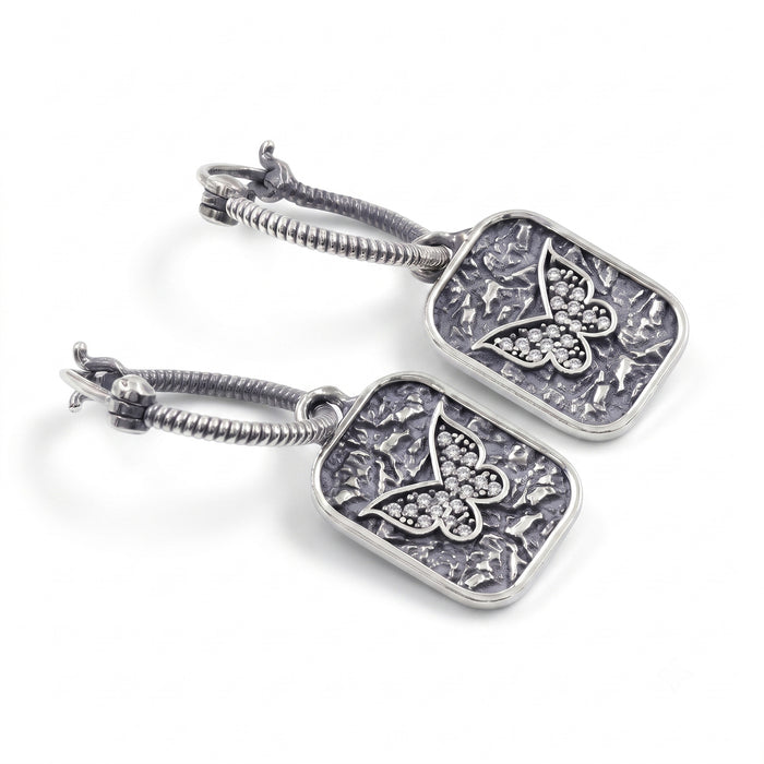 Silver plated butterfly hoop earrings with Swarovski crystal accents and textured rectangular charms for women