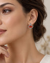 Red onyx J-Hoop earrings with Swarovski crystals in silver plated finish, displayed o a girl wearing this earring.