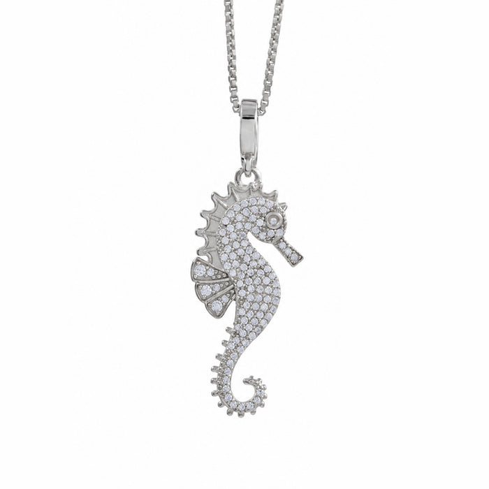 A silver seahorse pendant necklace paved with small clear stones, hanging from a silver box chain against a plain white background.