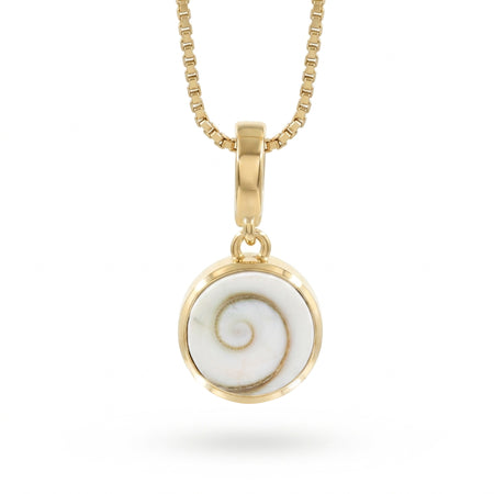 A gold necklace with a round bezel pendant featuring a Shiva Eye shell inlay, suspended from a gold box chain against a white background.