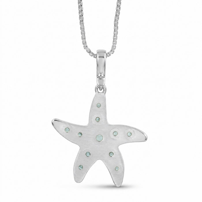 A silver starfish pendant necklace adorned with light blue-green  Amazonite stone, suspended from a silver box chain against a white background, shown from backside.