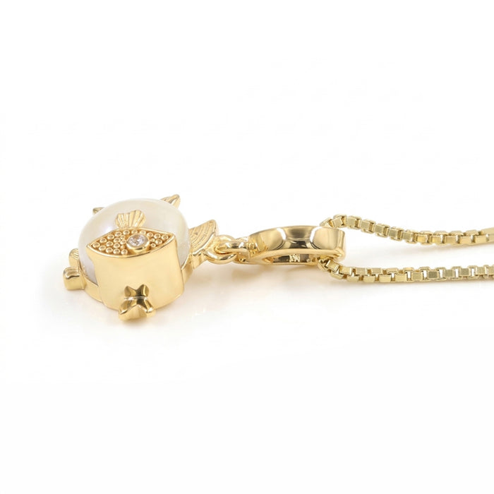 A gold fish pendant necklace featuring a large white pearl belly and a gold eye with tiny clear stones, suspended from a gold box chain on a white background.