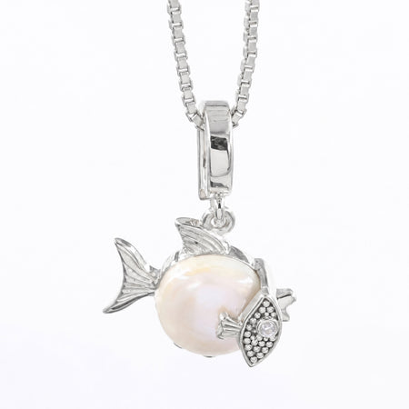 A silver fish pendant necklace featuring a large white pearl fish body and a silver eye detail with small clear stones, suspended from a silver box chain on a white background.