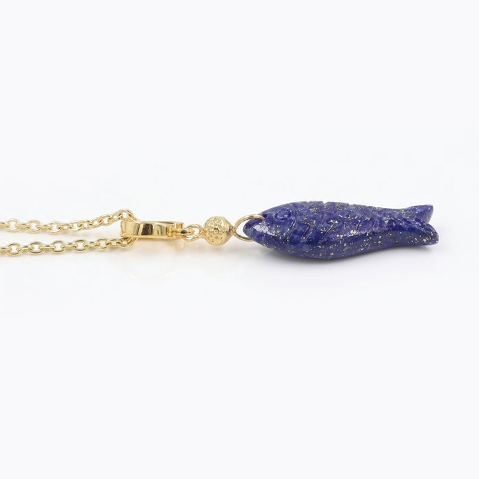 A gold chain necklace featuring a textured, elongated blue lapis lazuli pendant with fine gold flecks, displayed on a clean white background.