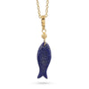 A gold chain necklace featuring a carved lapis lazuli fish pendant with gold flecks and a small gold beaded spacer, shown against a plain white background.