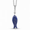 A silver fish pendant necklace featuring a textured, deep blue lapis lazuli-style fish body with embedded gold flakes, suspended from a silver chain with a small clear stone accent.
