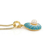 A gold pendant necklace featuring a nautilus shell-shaped enamel pendant topped with a single white pearl, suspended from a gold box chain on a white background.