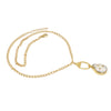 A gold chain necklace featuring a teardrop-shaped pendant with a white Freshwater pearl center and small gold dots, displayed on a clean white background.