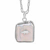 A silver chain necklace with a free size and fancy shape pendant featuring a white iridescent -biwa pearl background and a small gold animal in the center, shown on a plain white background.