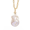 Back view of a gold paperclip chain necklace with a single free-size baroque freshwater pearl pendant featuring metal stud accents