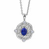 A silver pendant necklace featuring a textured round silver frame with four clear round-cut stones and a central oval blue lapis lazuli stone, suspended from a silver chain on a white background.