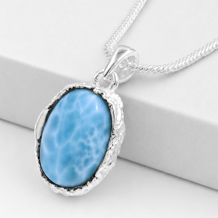 Natural Larimar Oval Gemstone Pendant in Silver plating on a white background
