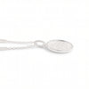 A silver oval pendant necklace with a textured, hammered finish inside a polished bezel setting, suspended from a delicate link chain against a plain white background.
