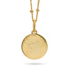 A 18K gold plated coin pendant necklace featuring an embossed circular design, suspended from a gold chain against a plain white background.
