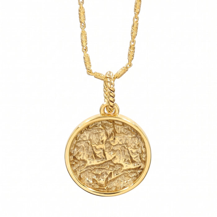 A 18K gold plated pendant necklace featuring a textured, circular medallion pendant on a matching twisted chain, shown against a plain white background.