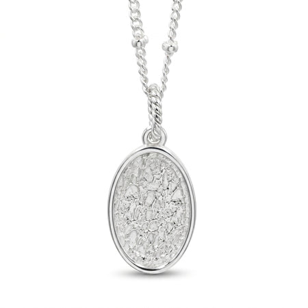 A silver oval pendant necklace featuring a textured, hammered or crackled metallic surface inside a polished bezel setting, suspended from a matching silver chain on a white background.