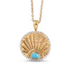 A gold pendant necklace featuring a circular fanburst design with a central turquoise stone and a border of small clear stones, shown on a white background.