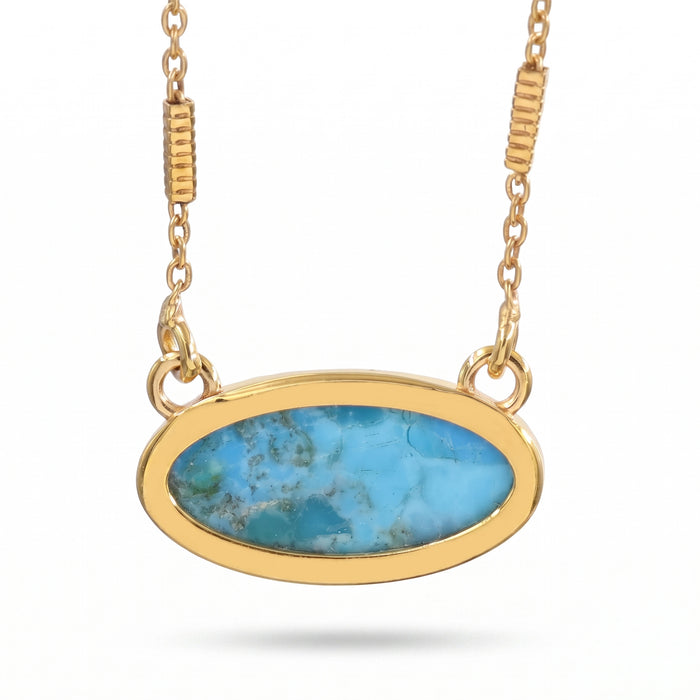 An oval pendant necklace featuring a vibrant turquoise-blue marbled stone in a polished gold bezel setting, suspended from a matching gold chain against a white background.