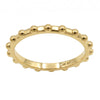 A yellow gold beaded band ring with a polished finish, set against a plain white background.