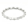 A silver beaded band ring with a polished finish, set against a plain white background.