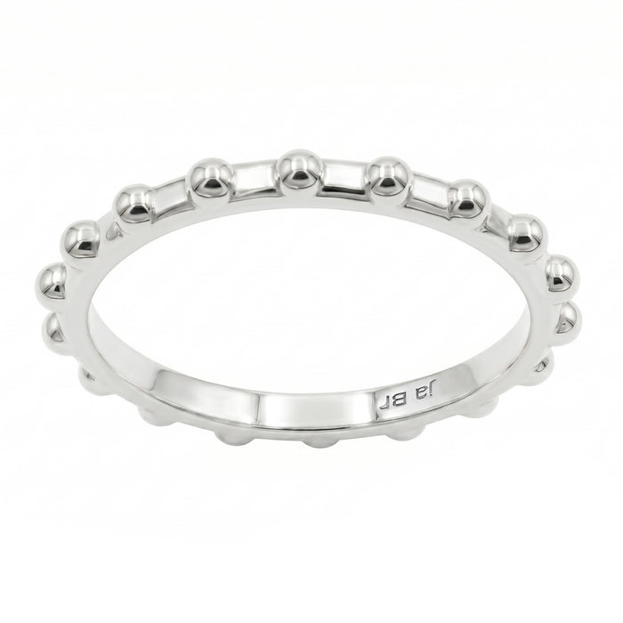 A silver beaded band ring with a polished finish, set against a plain white background.
