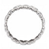A polished silver band ring with a textured, wavy, organic raised pattern around the circumference, shown on a plain white background.