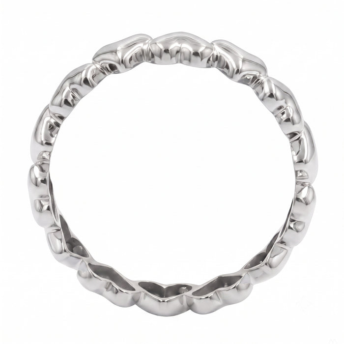 A polished silver band ring with a textured, wavy, organic raised pattern around the circumference, shown on a plain white background.