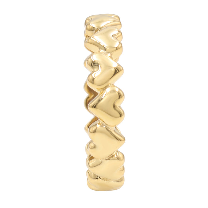 A polished yellow gold ring featuring a vertical column of raised, wavy heart-shaped links, shown against a plain white background.