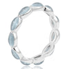 Silver ring with Aquamarine blue gemstones on a white background