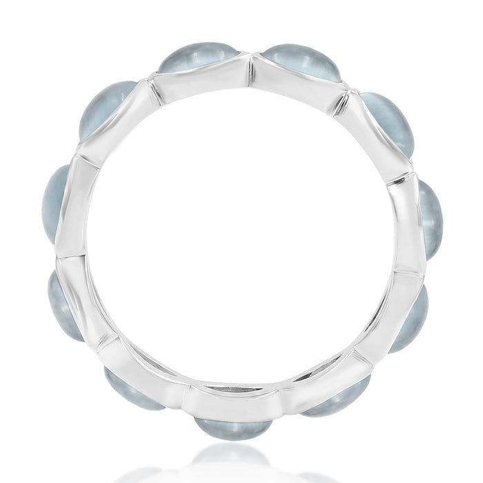 Silver ring with Aquamarine blue gemstones on a white background