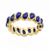 Front view of 18K gold plated eternity statement ring set with 16 pear-cut natural lapis lazuli gemstones