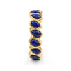 Close-up view of lapis lazuli pear-cut eternity ring showing prong settings and natural pyrite inclusions