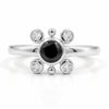 Natural black onyx ring in silver plated finish with one 5×5 mm round black onyx gemstone and four Swarovski crystal accents.