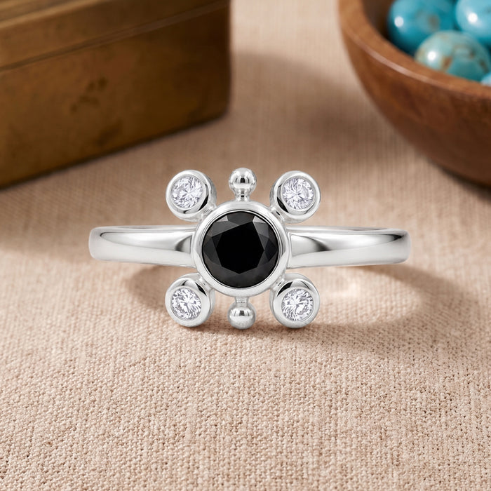 Natural black onyx ring in silver plated finish with one 5×5 mm round black onyx gemstone and four Swarovski crystal accents.