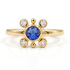 
Natural tanzanite and Swarovski crystal bezel ring in 18K gold plated and silver plated finishes with round gemstones.