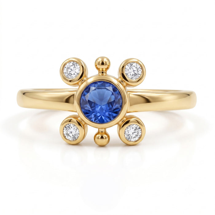 
Natural tanzanite and Swarovski crystal bezel ring in 18K gold plated and silver plated finishes with round gemstones.