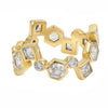 A gold ring featuring a series of hexagonal, round and square bezel-set clear gemstones, displayed on a clean white background.