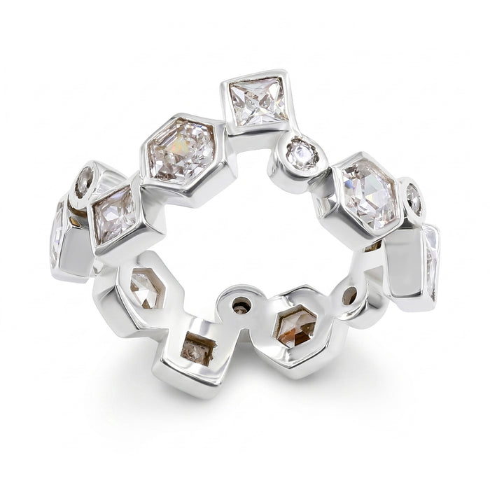 A silver-toned eternity ring featuring multiple bezel-set clear stones in square, round and hexagonal shapes, arranged in a continuous band on a white background.