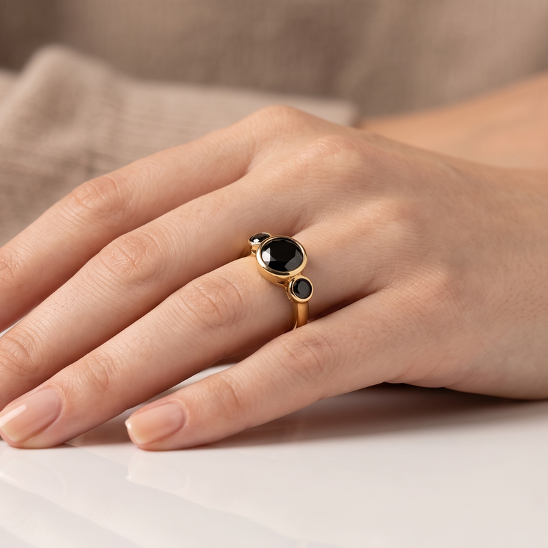 natural black onyx three stone ring in 18k gold plated finish with round bezel set gemstones