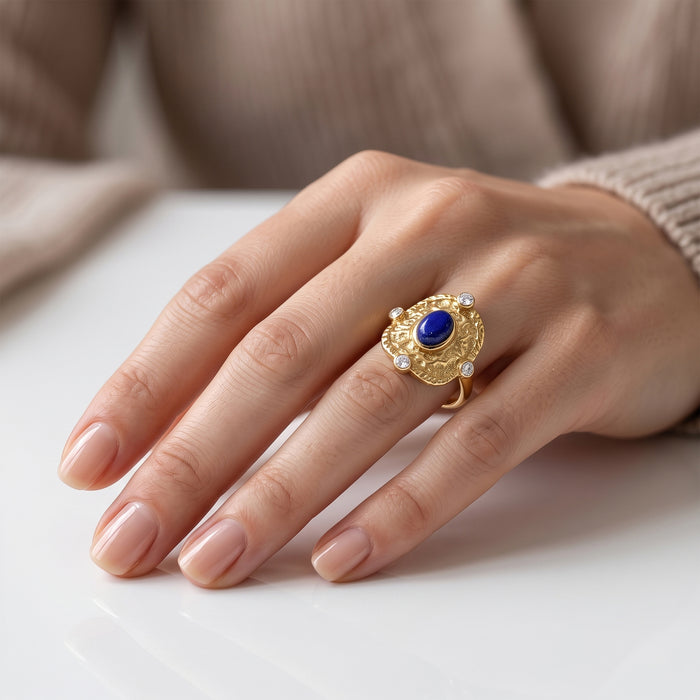 Natural lapis lazuli statement ring with Swarovski crystal accents in 18K gold plated finish.