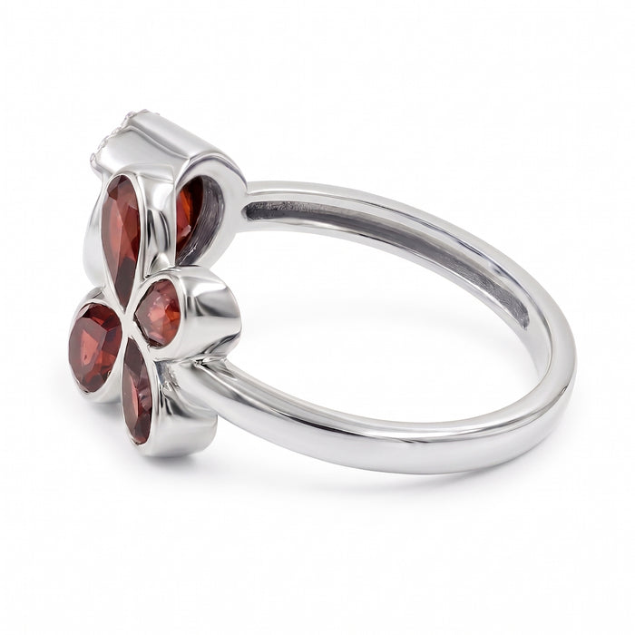 Natural garnet floral bypass ring with pear-cut garnet gemstones and Swarovski crystal accents in 18K gold & silver plated finish on a white background.