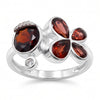 Natural garnet floral bypass ring with pear-cut garnet gemstones and Swarovski crystal accents in 18K gold & silver plated finish on a white background.