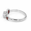 Natural garnet and Swarovski crystal ring in 18K gold plated and silver plated finishes featuring oval, round, and square bezel-set gemstones
